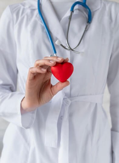 Provider holding a heart, symbolizing compassionate care